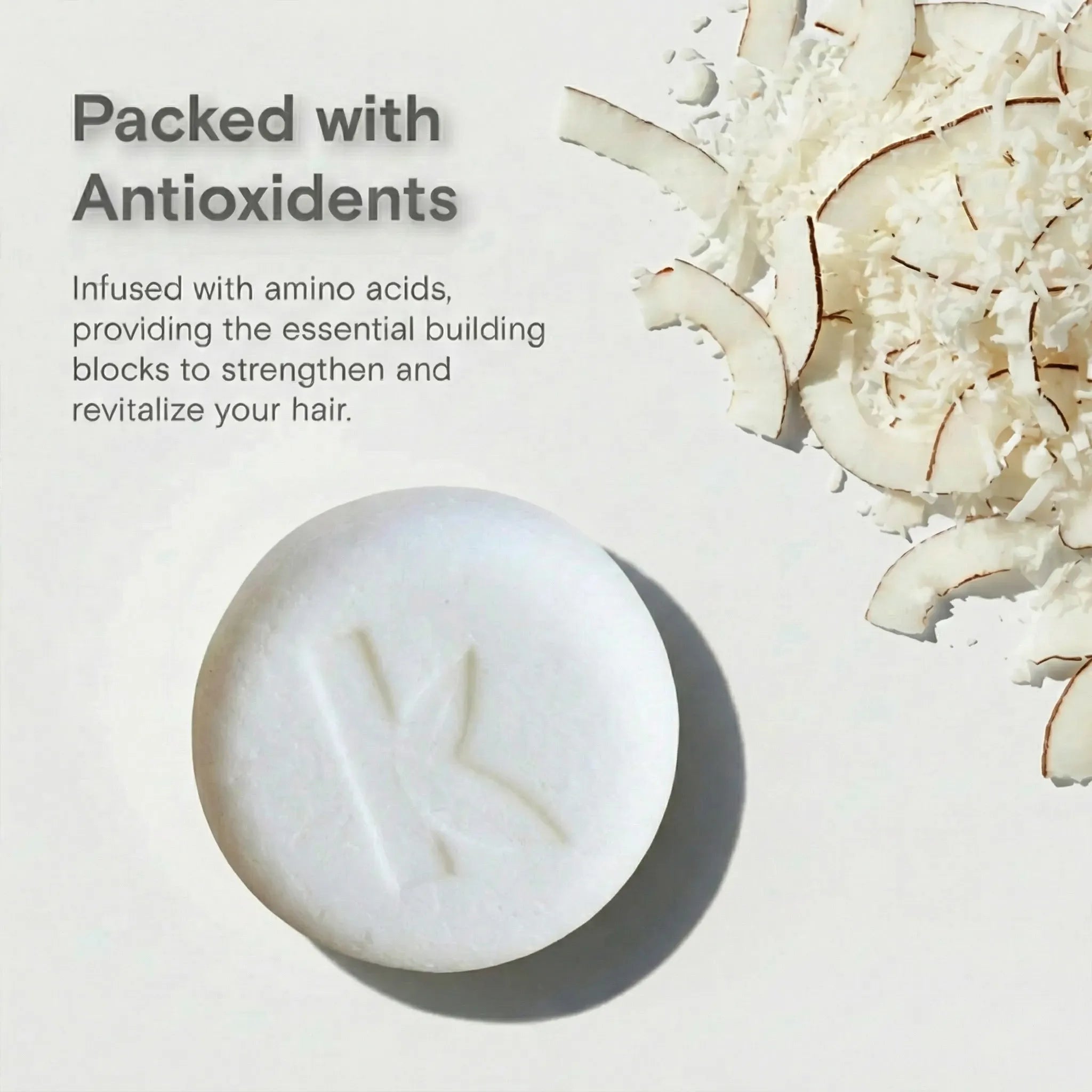 solid coconut shampoo bar with text about antioxidants and amino acids on a light background