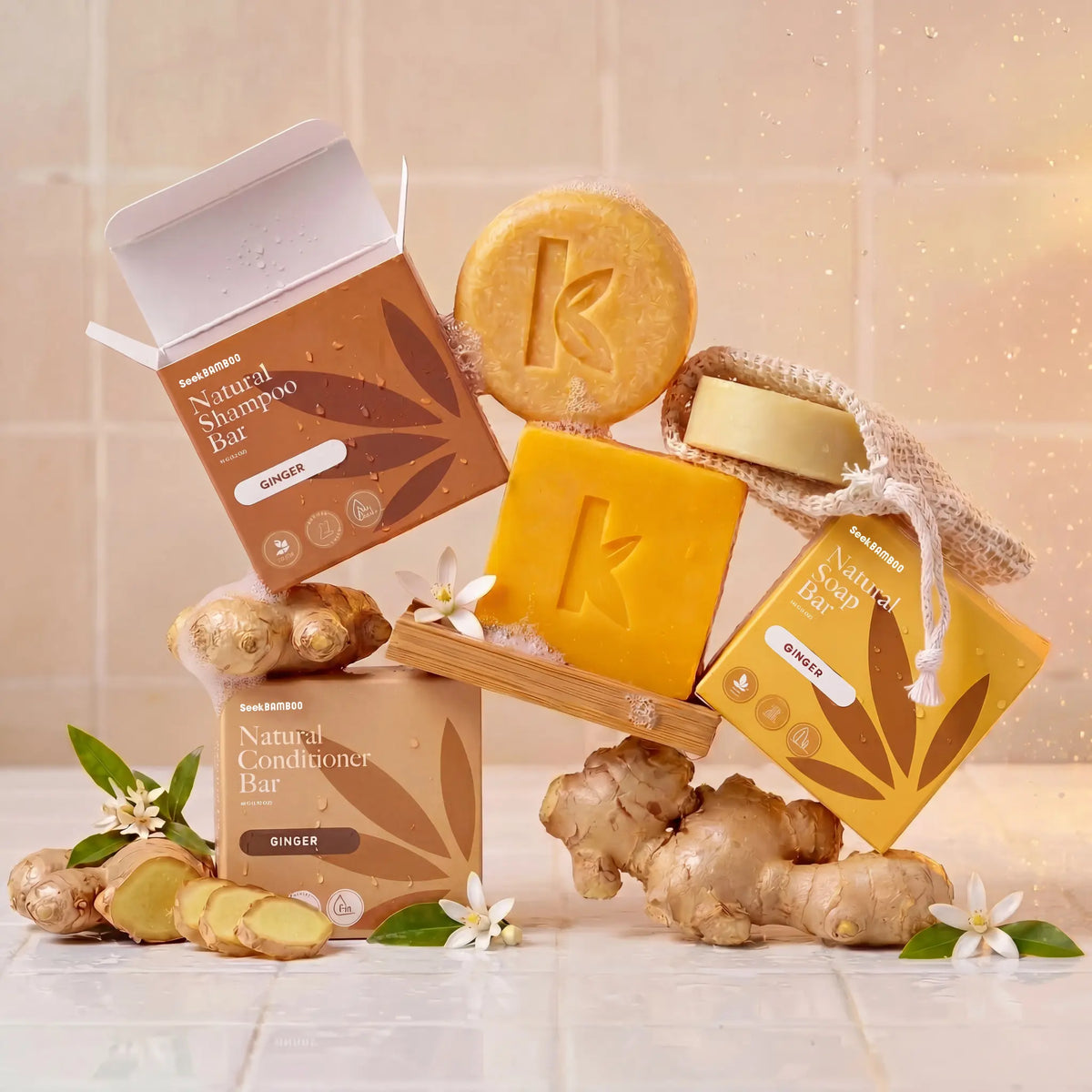 Collection of natural ginger products including bars and boxes on a light background