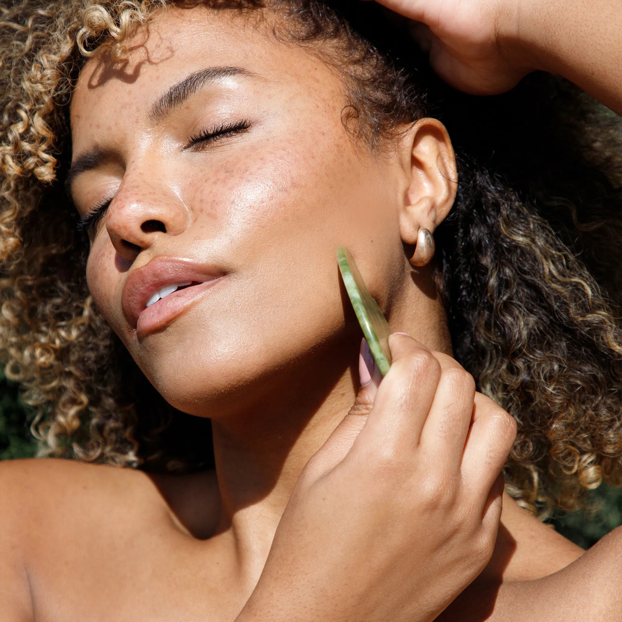 Green Jade Gua Sha used on chin line