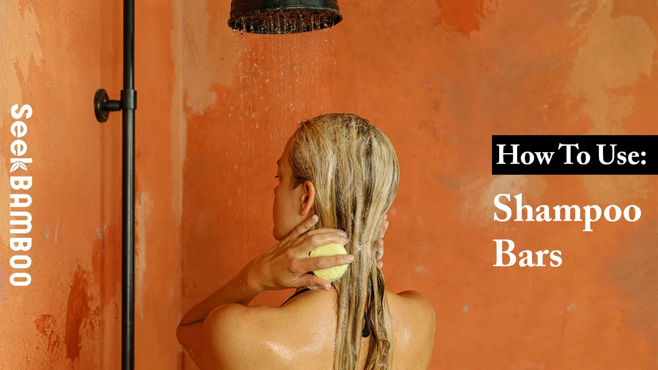 Woman using an eco-friendly shampoo bar in a shower, emphasizing sustainable hair care and how to use
