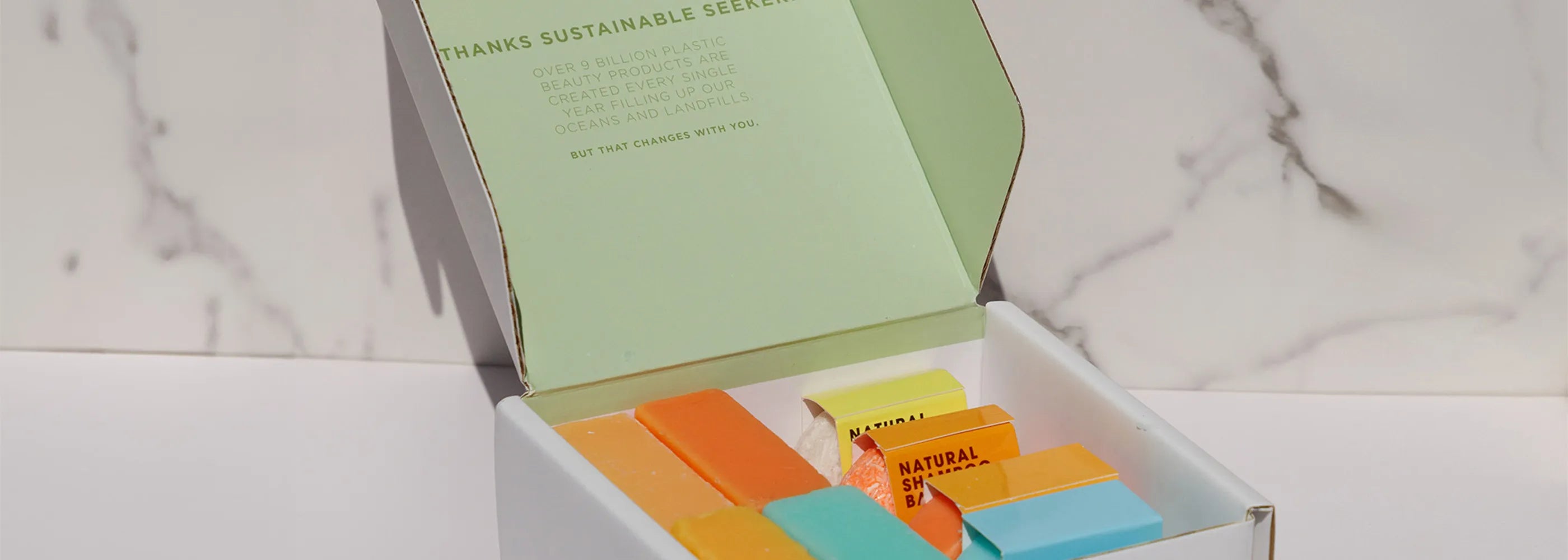 shampoo and soaps in a seek bamboo box