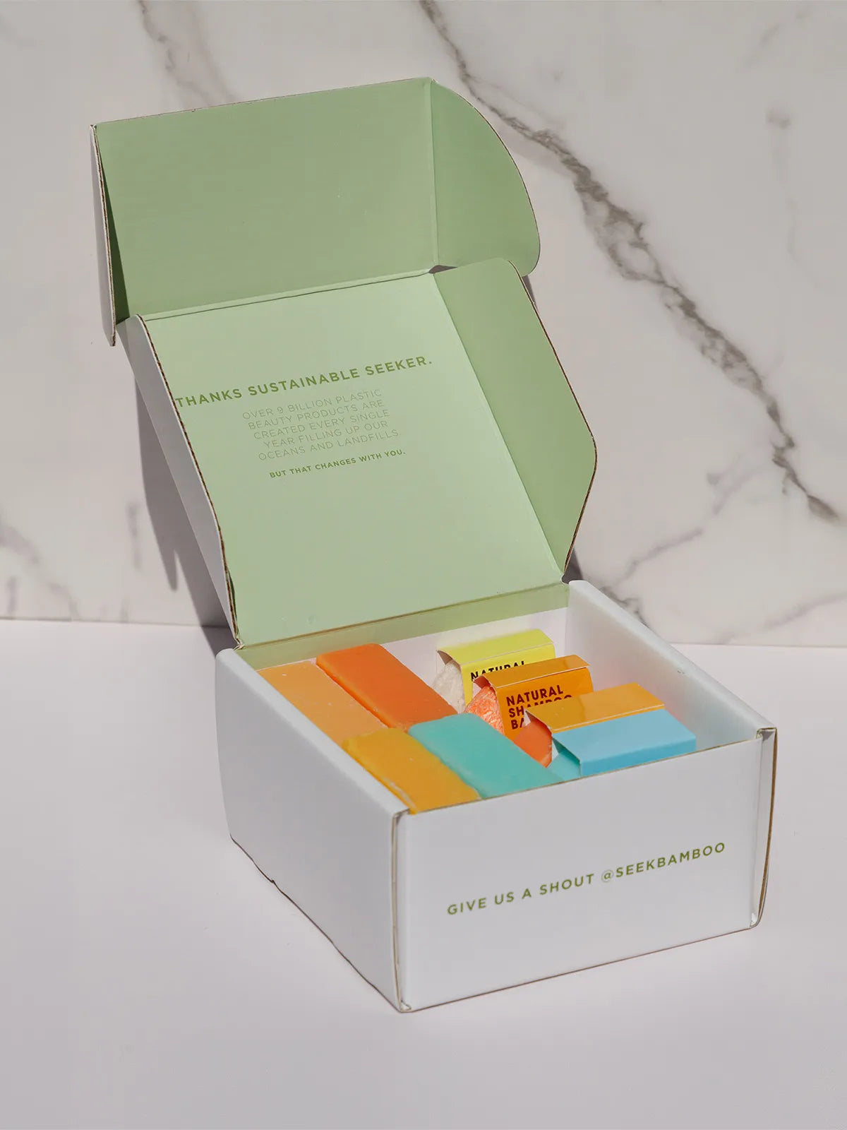 soap and shampoo in a seek bamboo box