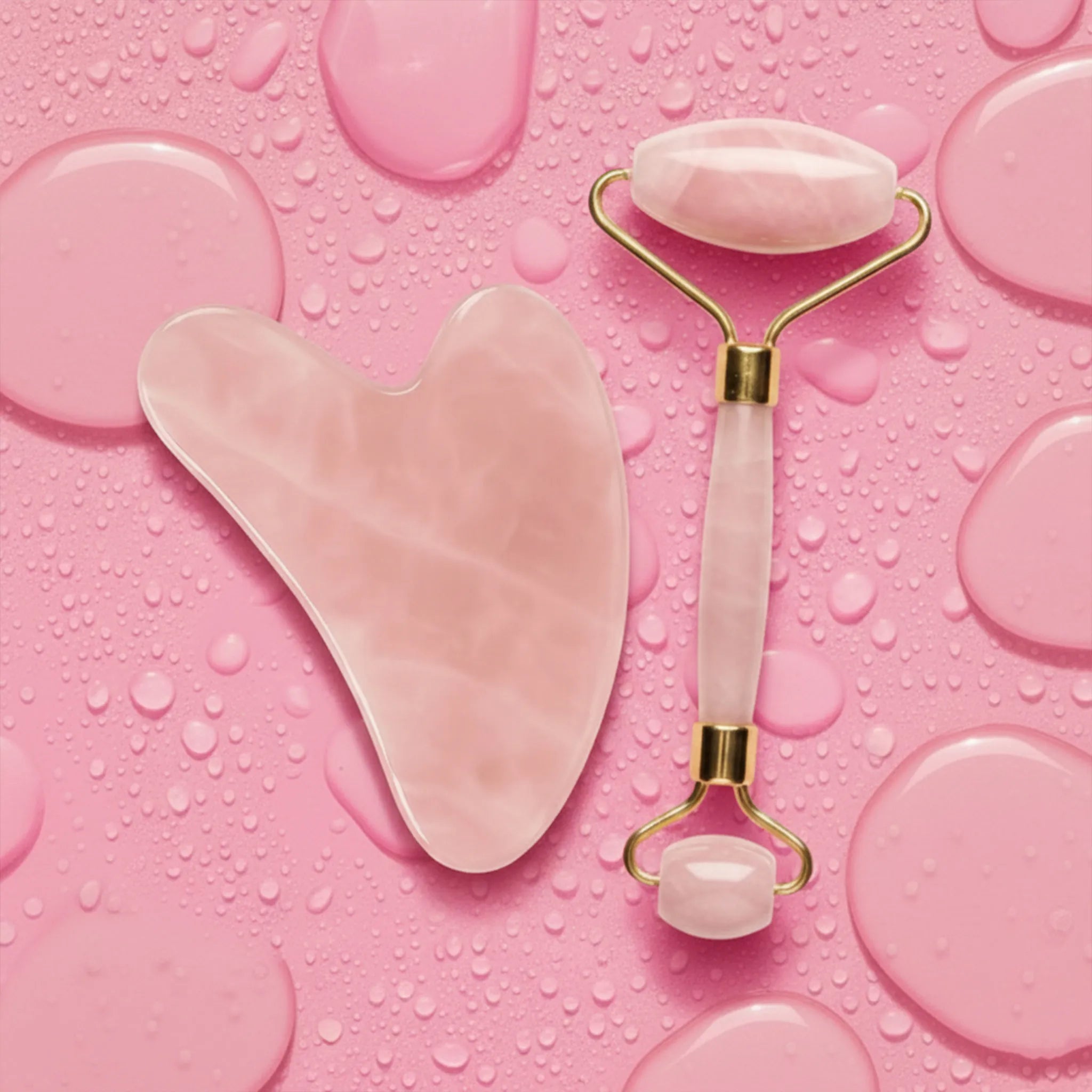 Rose Quartz Roller and Gua Sha On pink background
