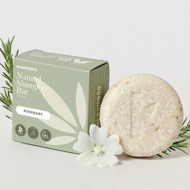 rosemary oil shampoo from seek bamboo as a main product image with a white background and floral elements