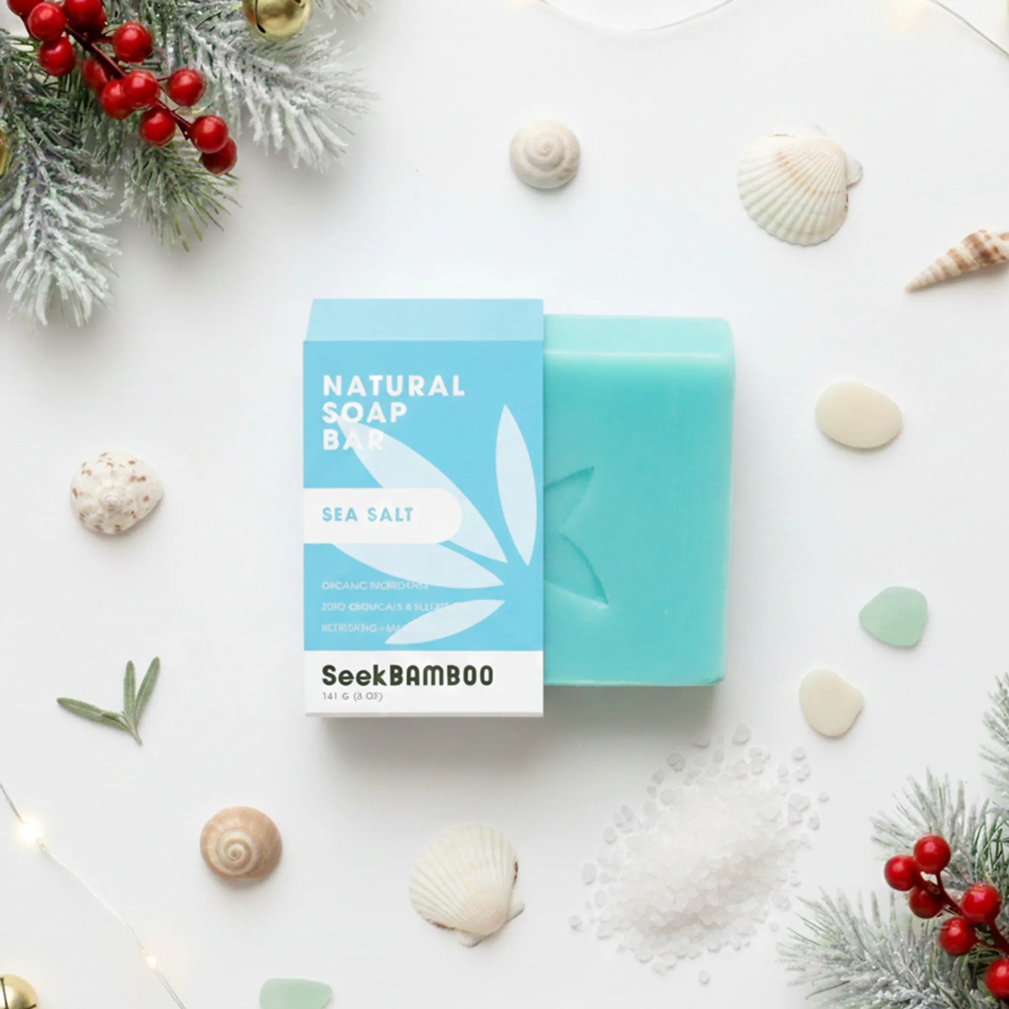 Natural sea salt soap bar with packaging labeled 'SeekBamboo' on a decorative background with shells and berries.