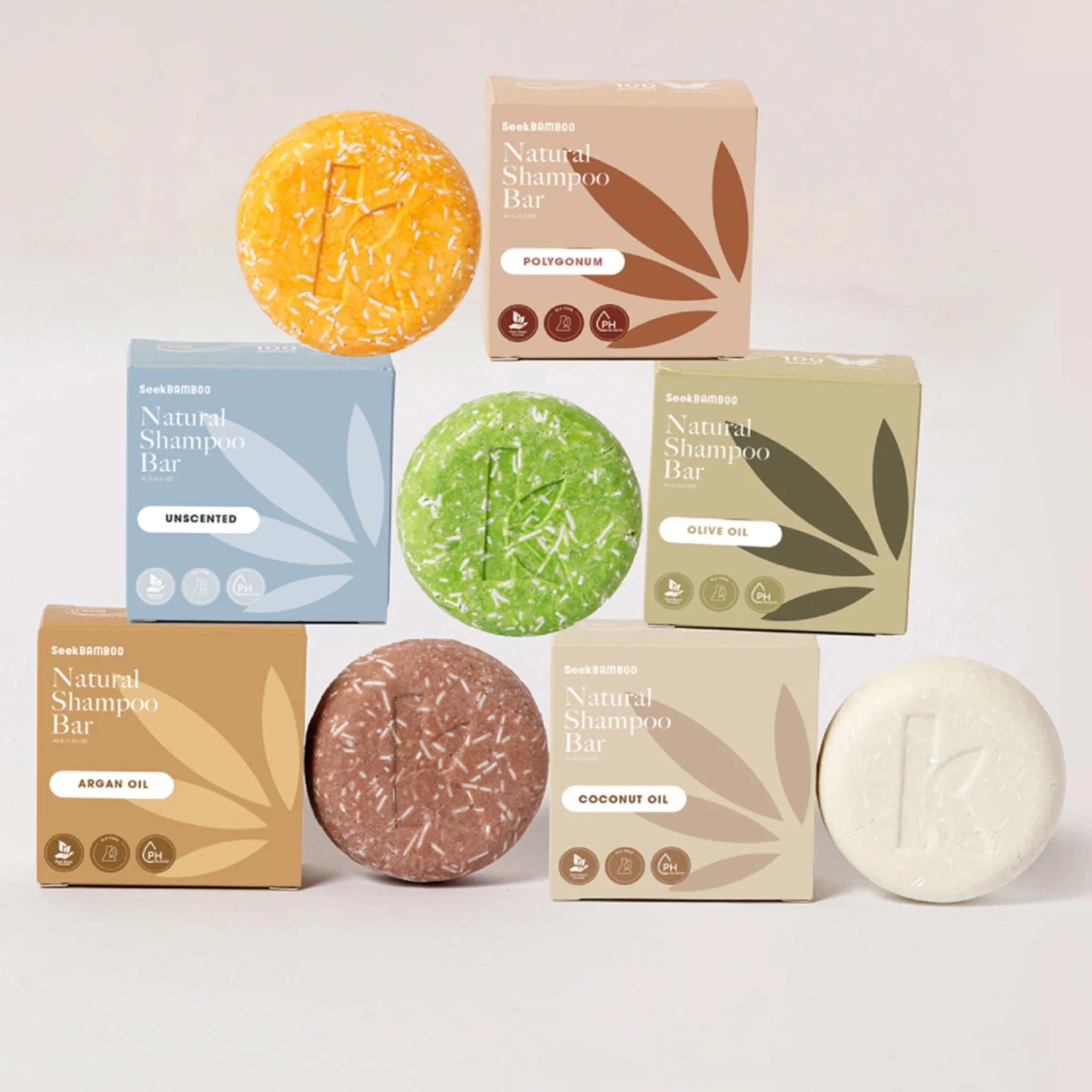 Collection of natural shampoo bars by seek bamboo and boxes on a light background