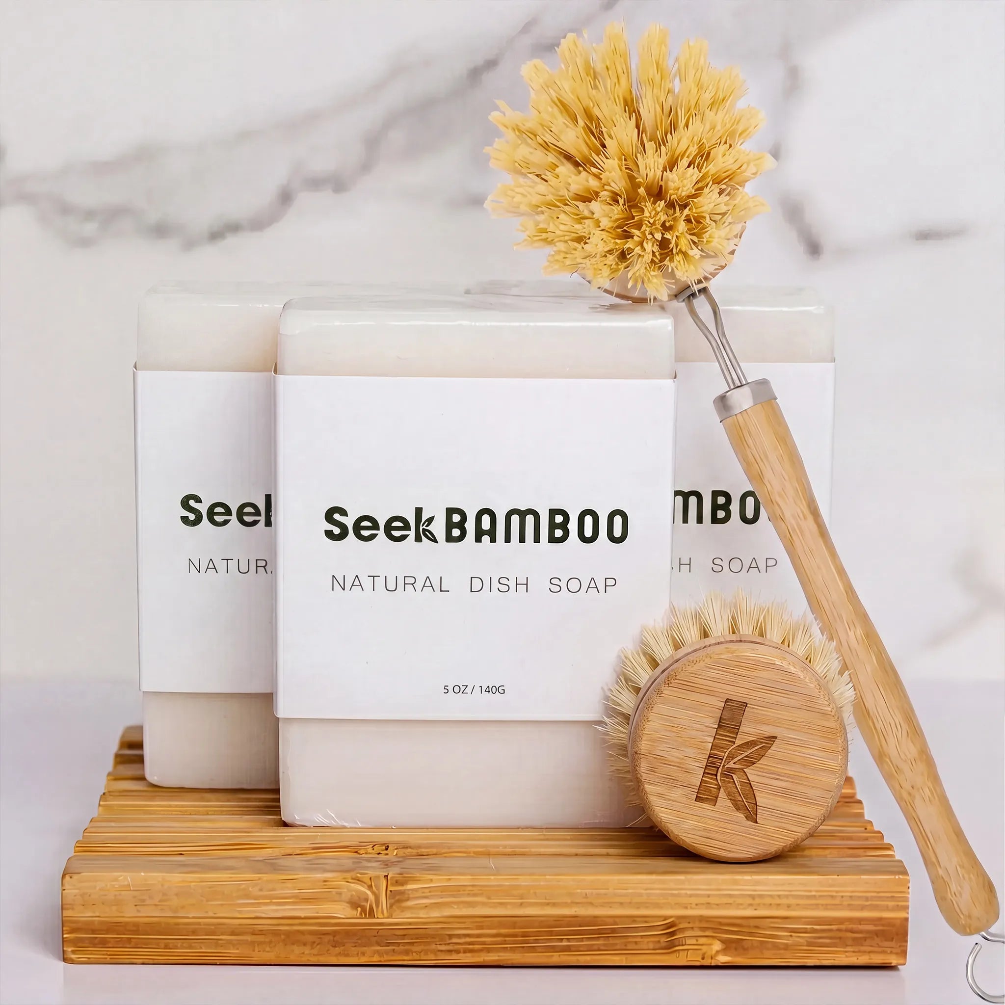 SeekBamboo natural dish soap with a bamboo scrubber and dishwashing brush on a white background