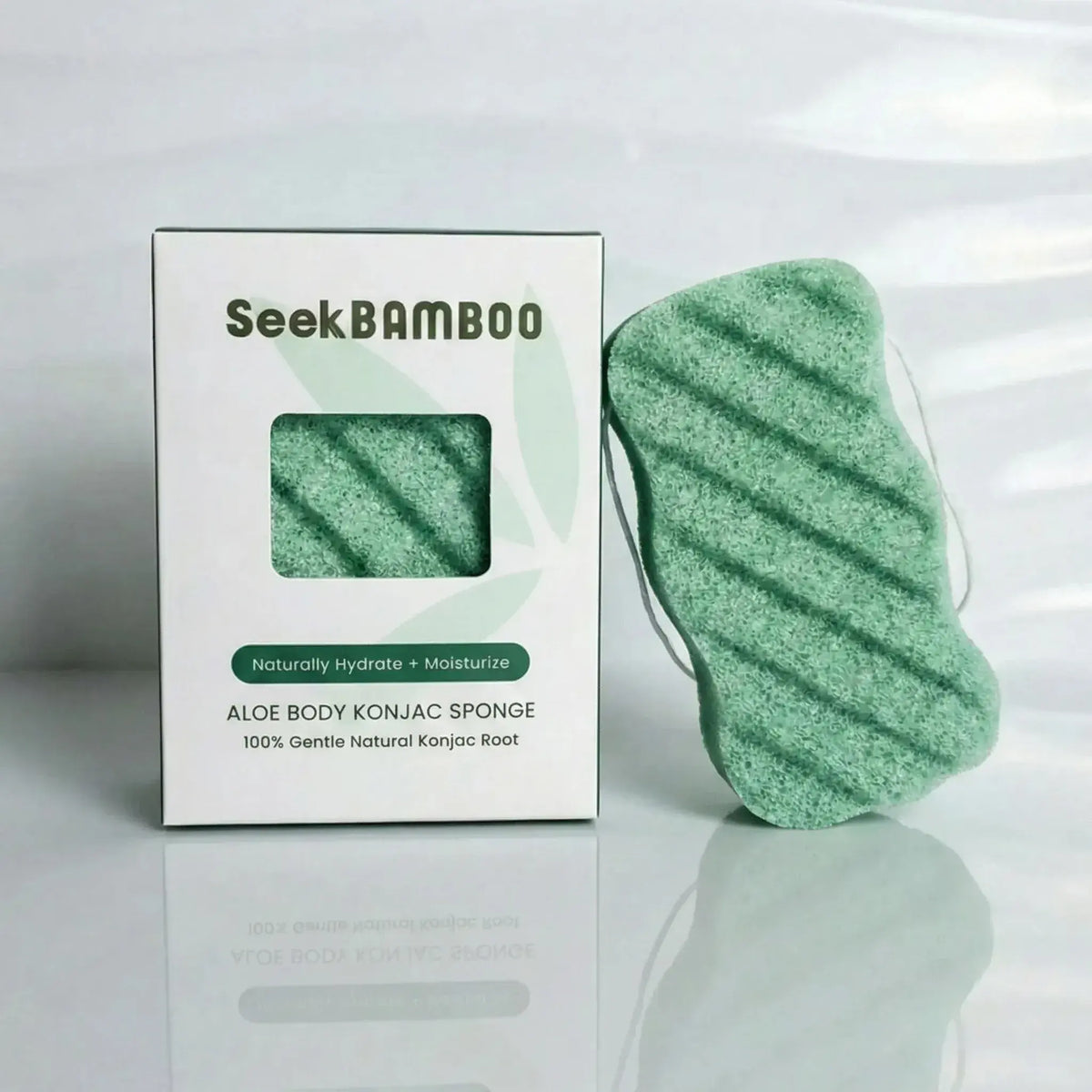 Seek Bamboo aloe body konjac sponge with box, displayed on a reflective white surface.
