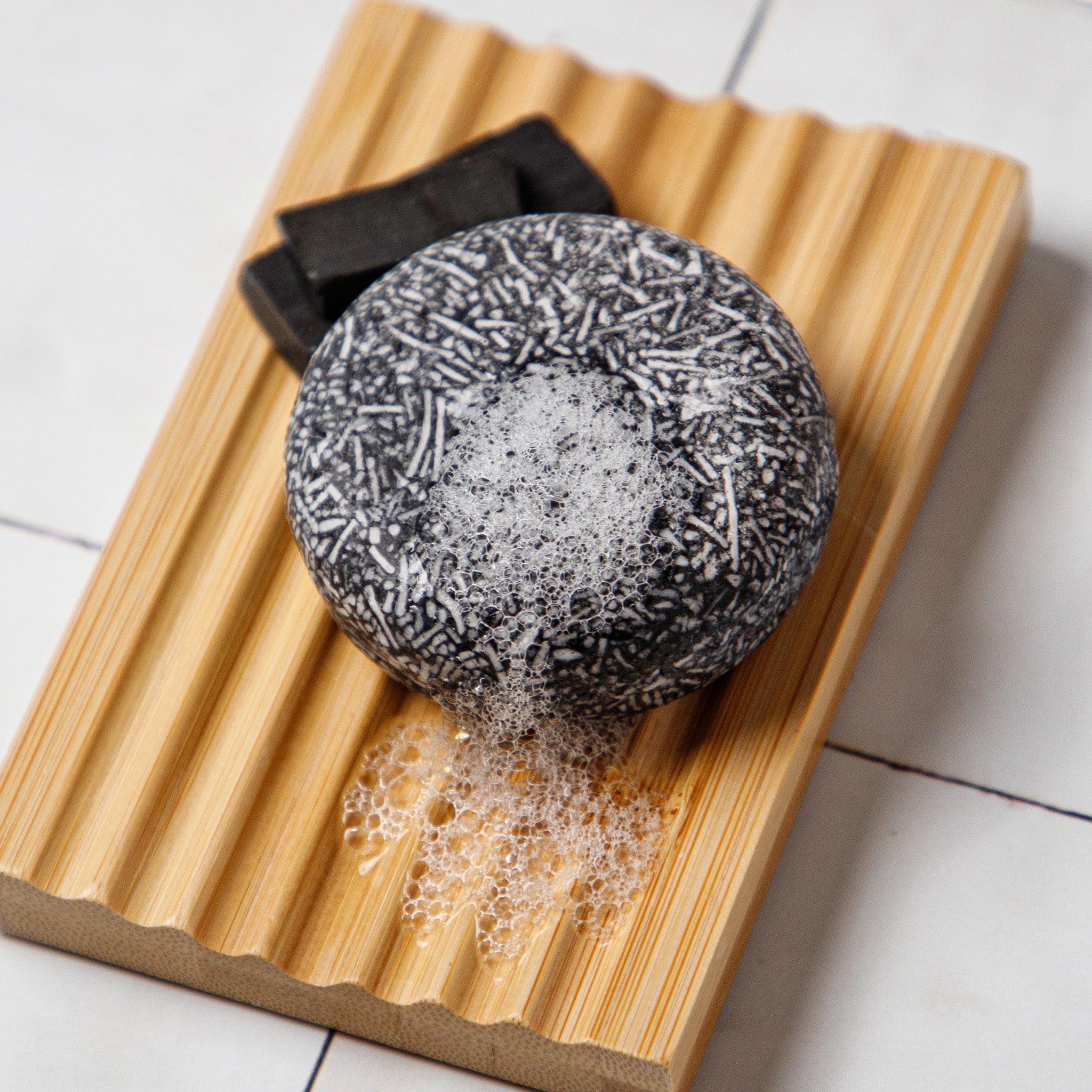 bamboo soap dish with charcoal shampoo bar