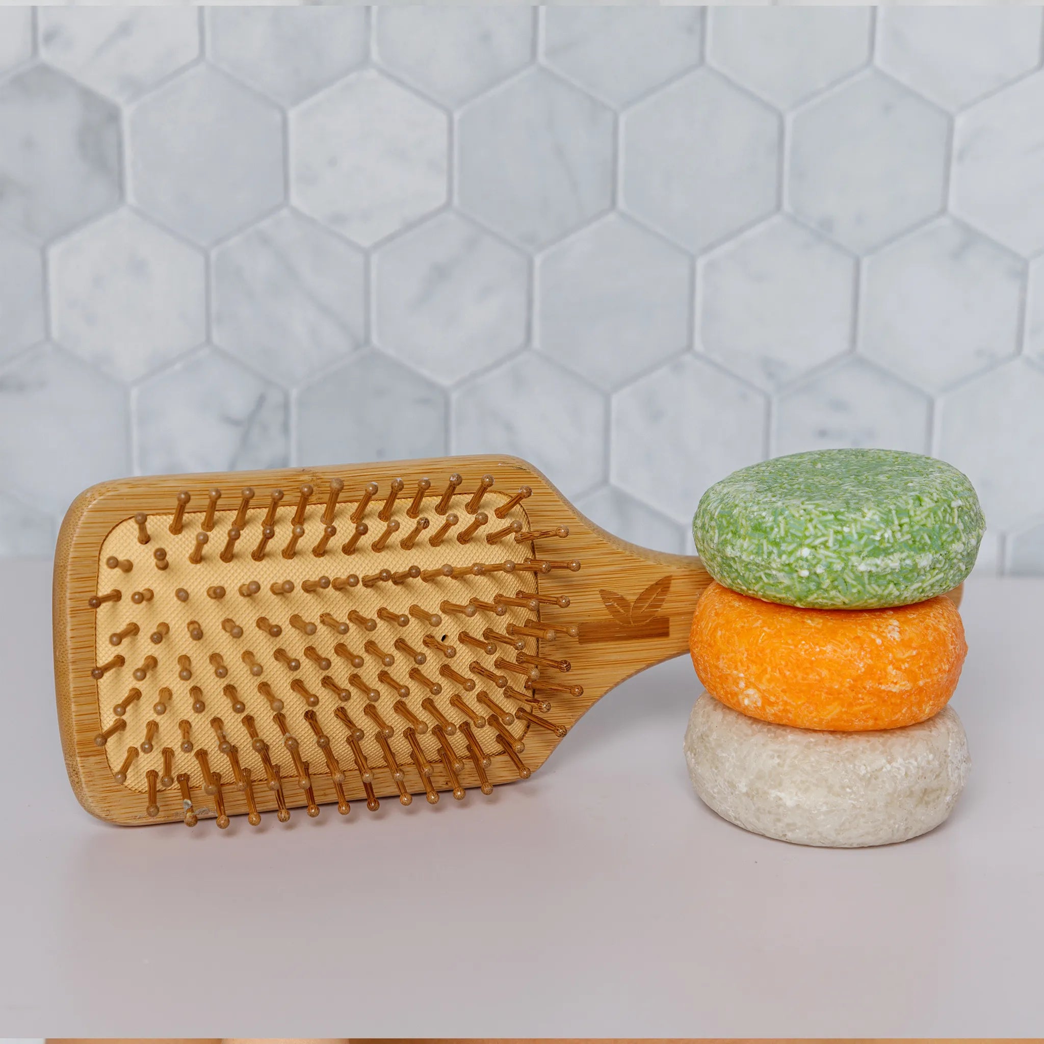 bamboo brush with a shampoo bar stack