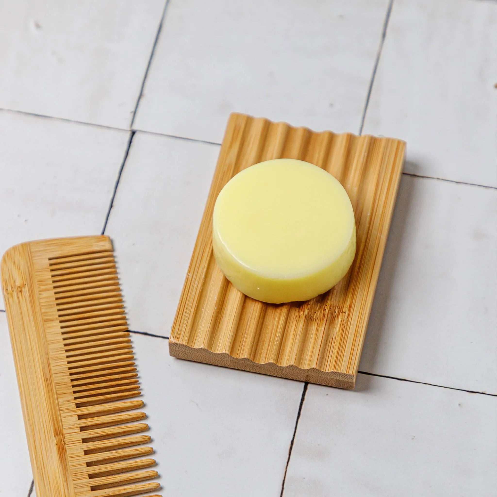 conditioner bar on a bamboo dish rack on tile