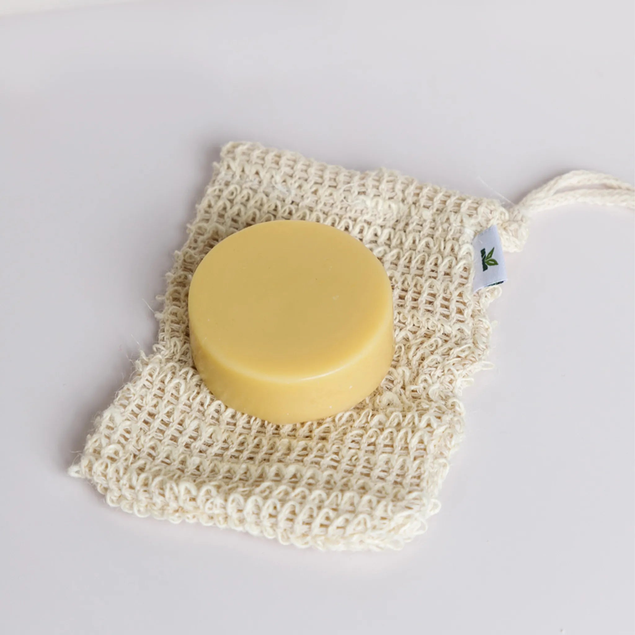 ginger conditioner bar on a sisal soap bag from seek bamboo