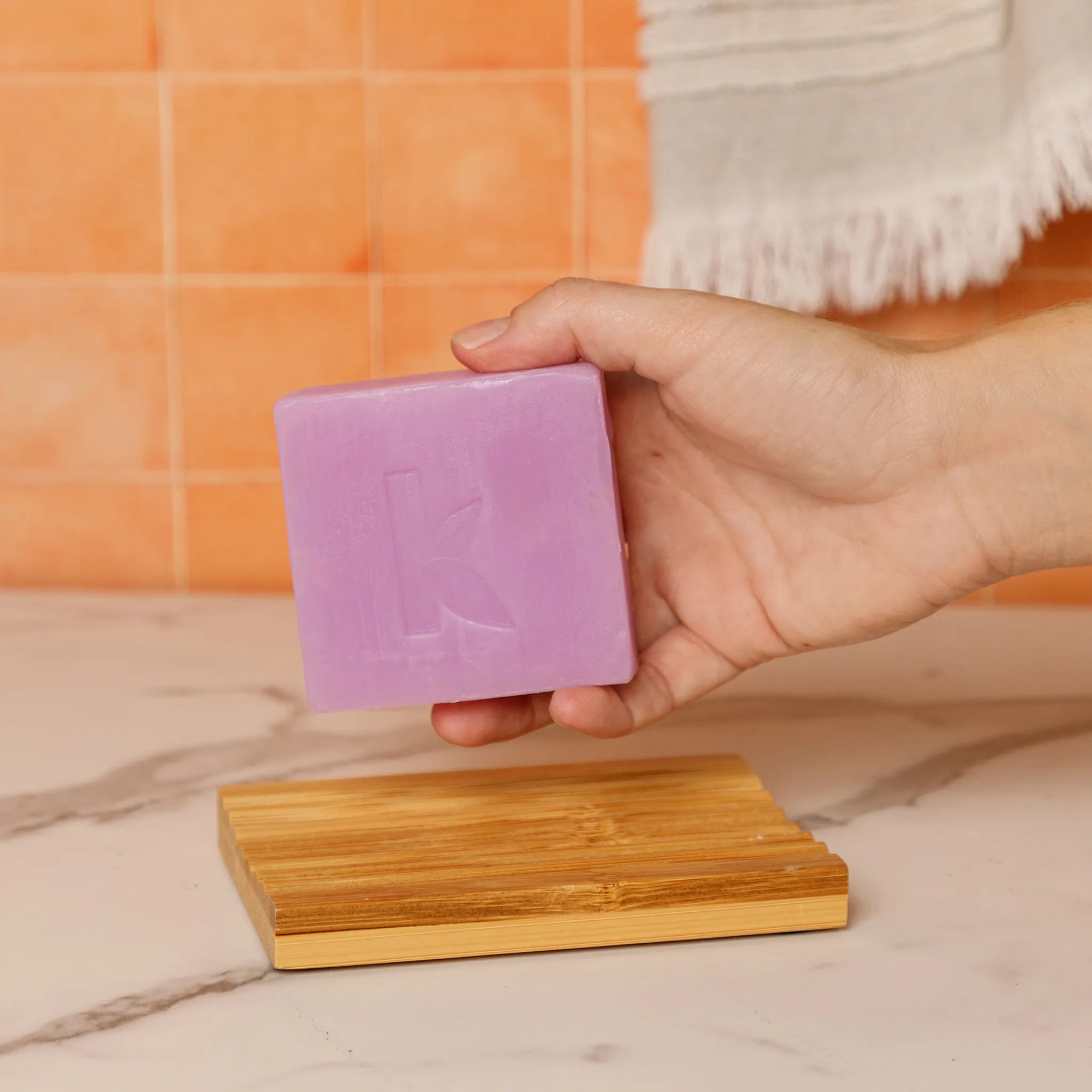 lavender soap held in a hand