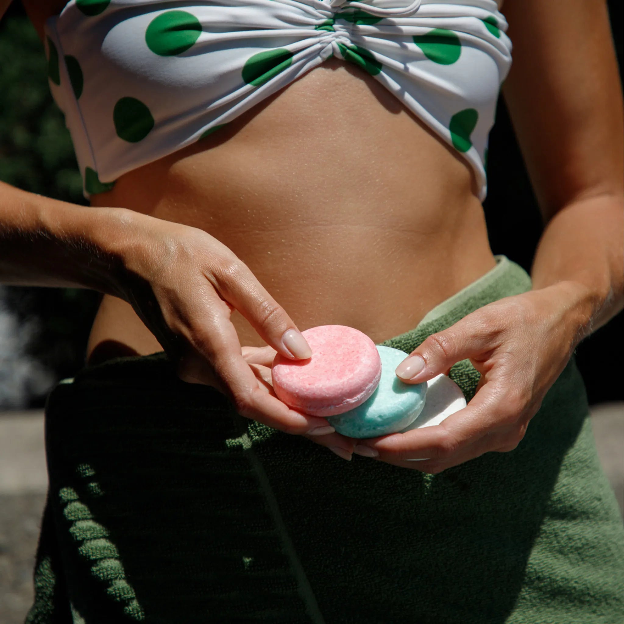 rose shampoo being held in a hand