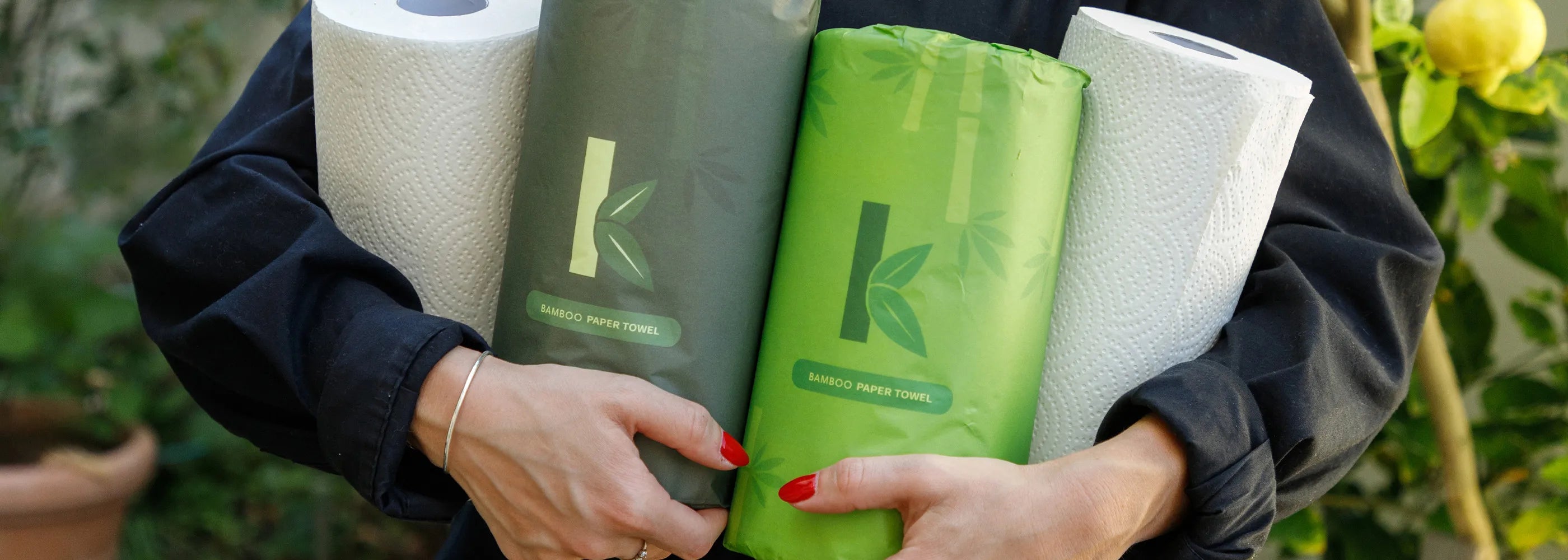 a woman holding the best non-toxic paper towels from seek bamboo