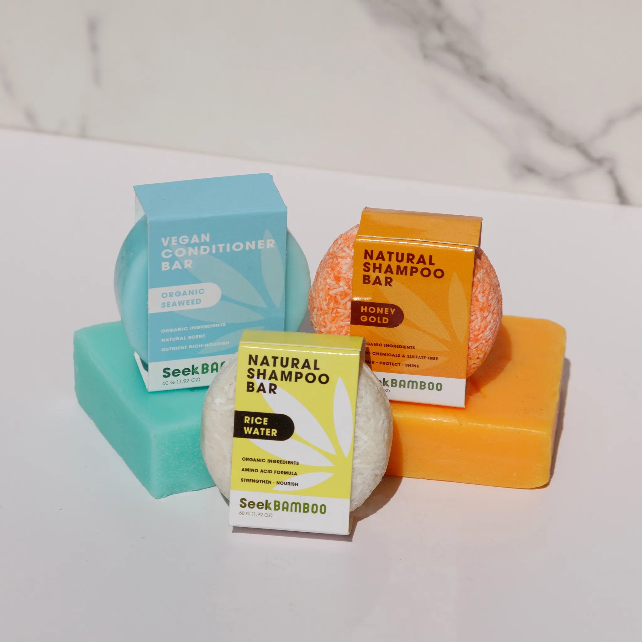 shampoo bars leaning against body soap bars highlgting seek bamboo bars