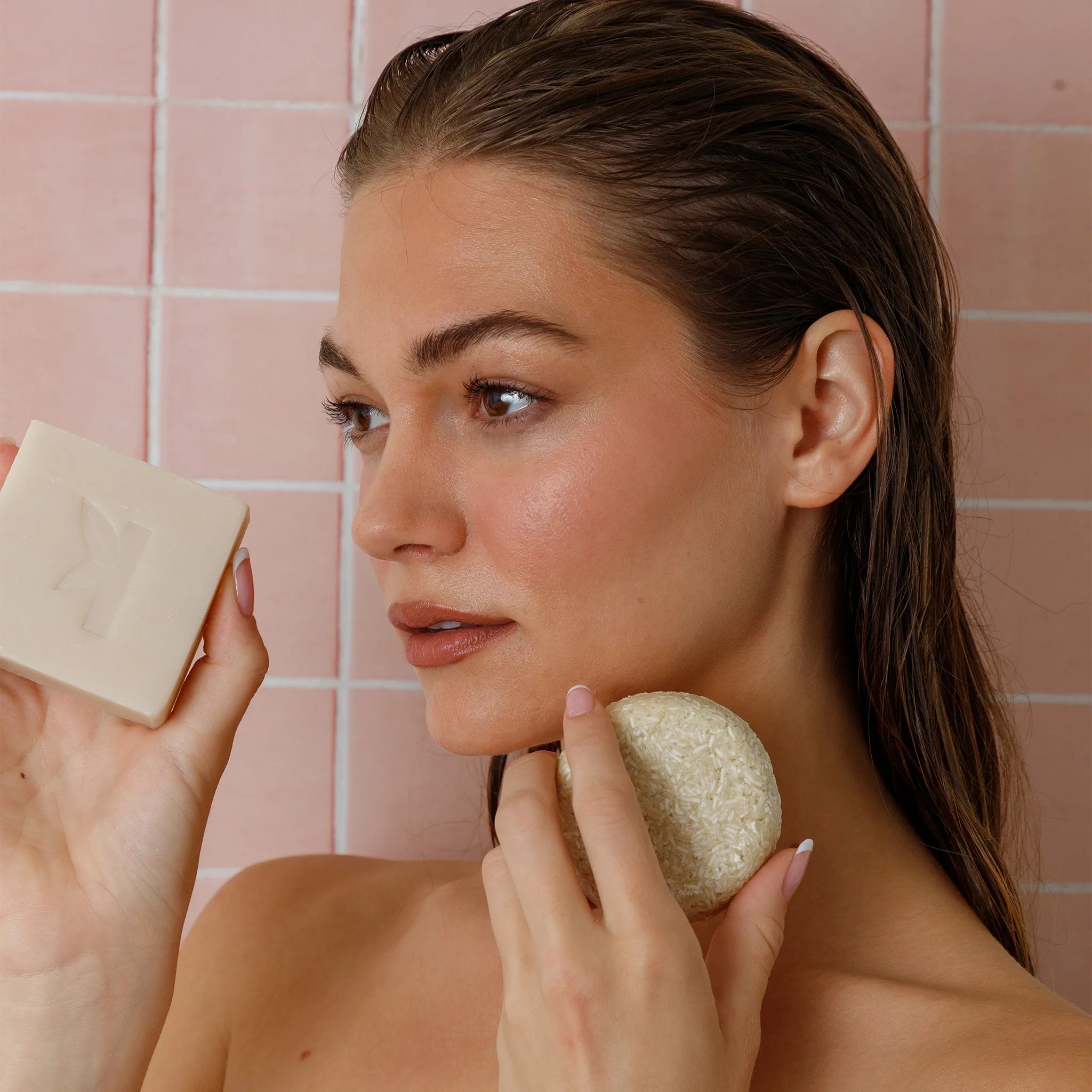 rosmeary shampo and soap held in hands