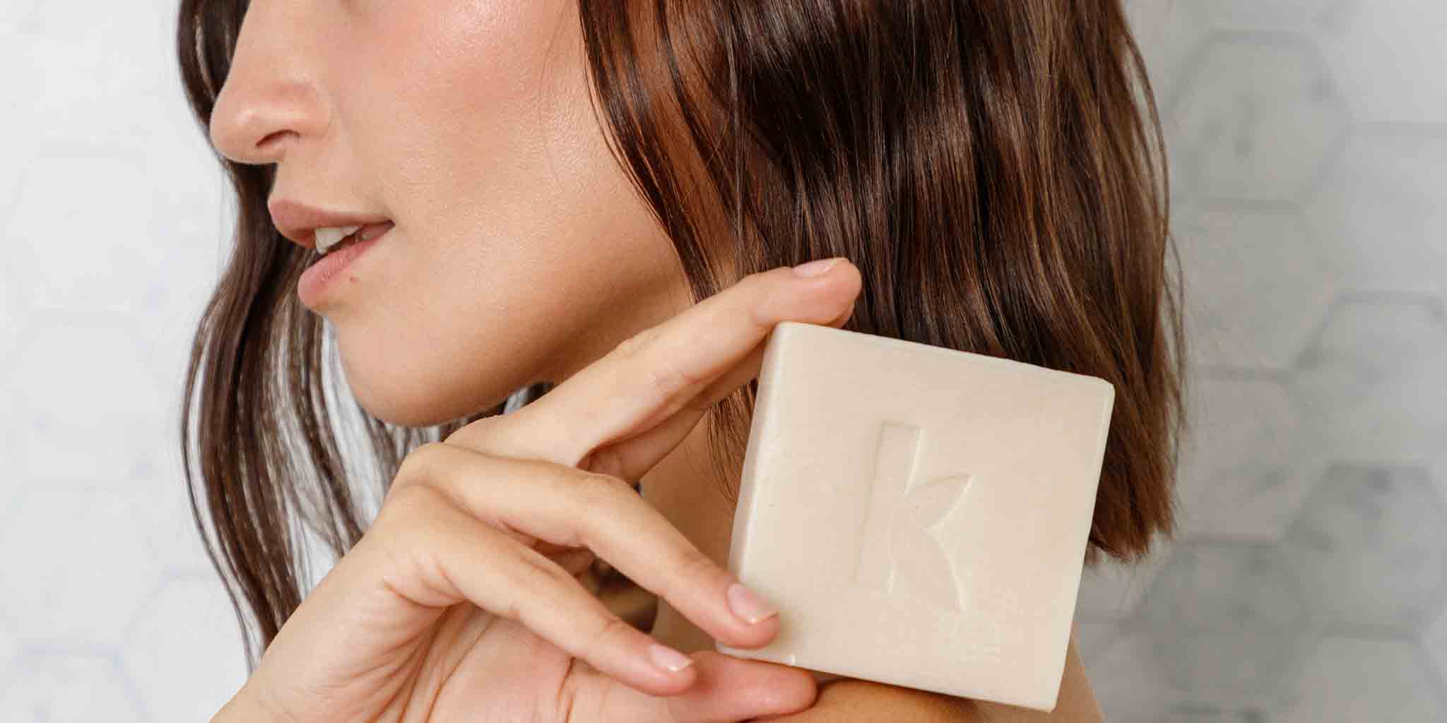 woman hold bar soap for sensitive skin