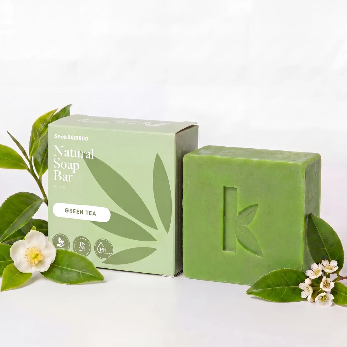 Green tea soap bar with packaging on a white background