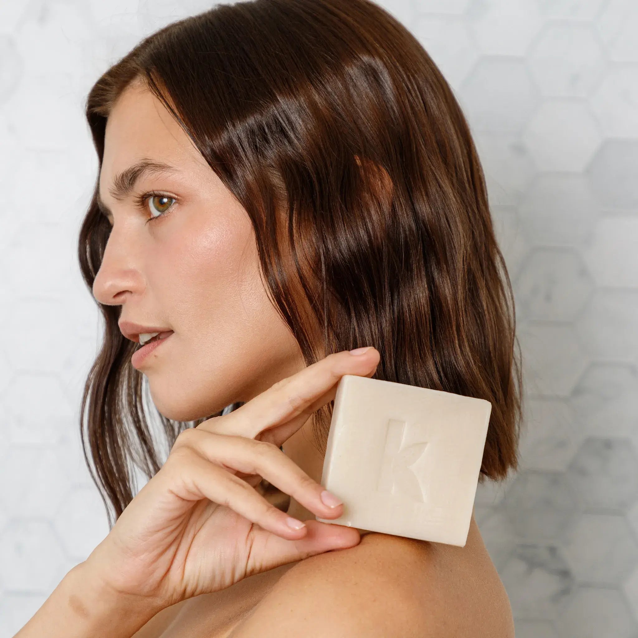 woman holding a soap vanilla