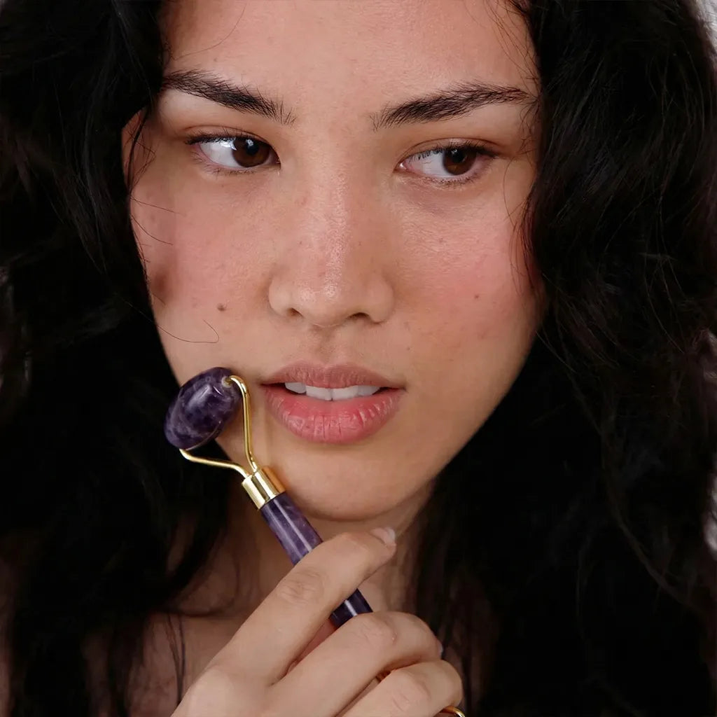 Amethyst Facial Roller used on female womans face