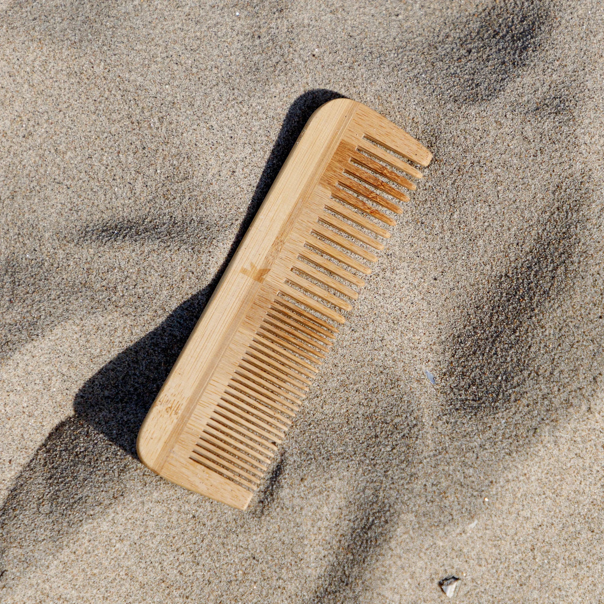 bamboo comb on sand
