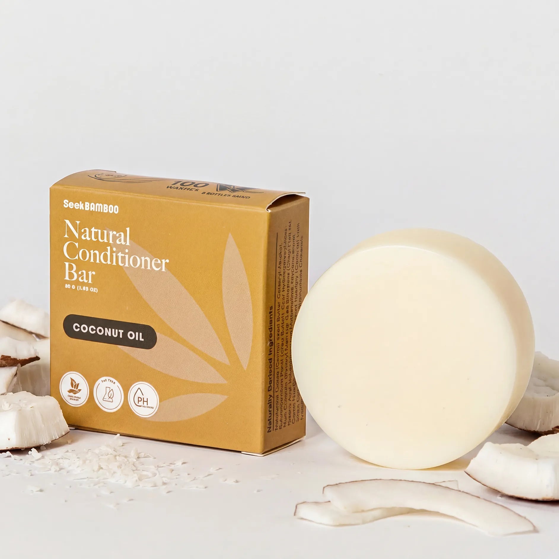 Vegan coconut conditioner bar with SeekBamboo packaging on a light background