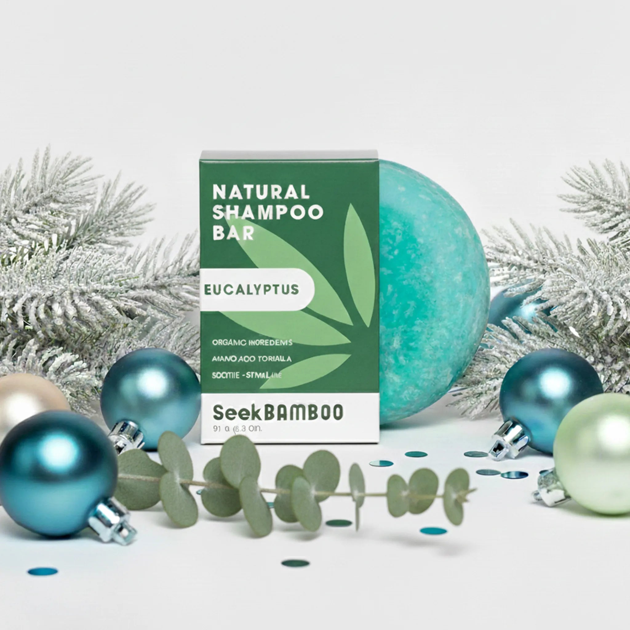 Natural eucalptyus shampoo bar with packaging and Christmas ornaments on a white background