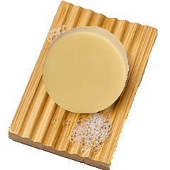 ginger bar on a bamboo soap dish