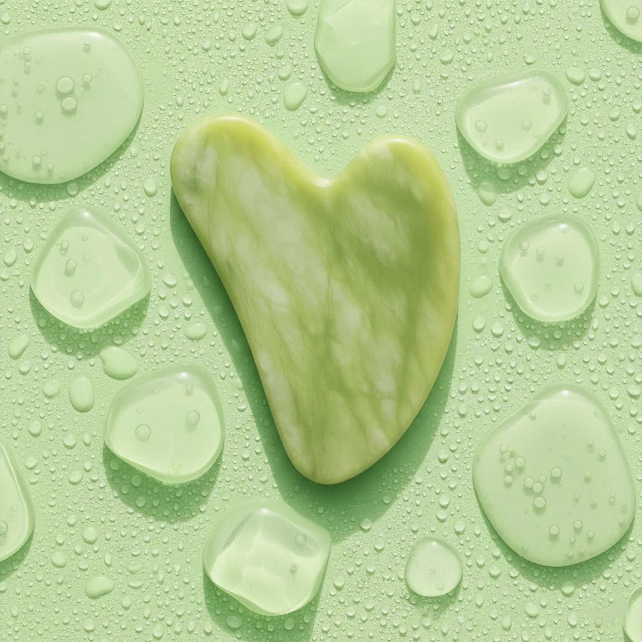 Jade Gua Sha Displayed next to ice