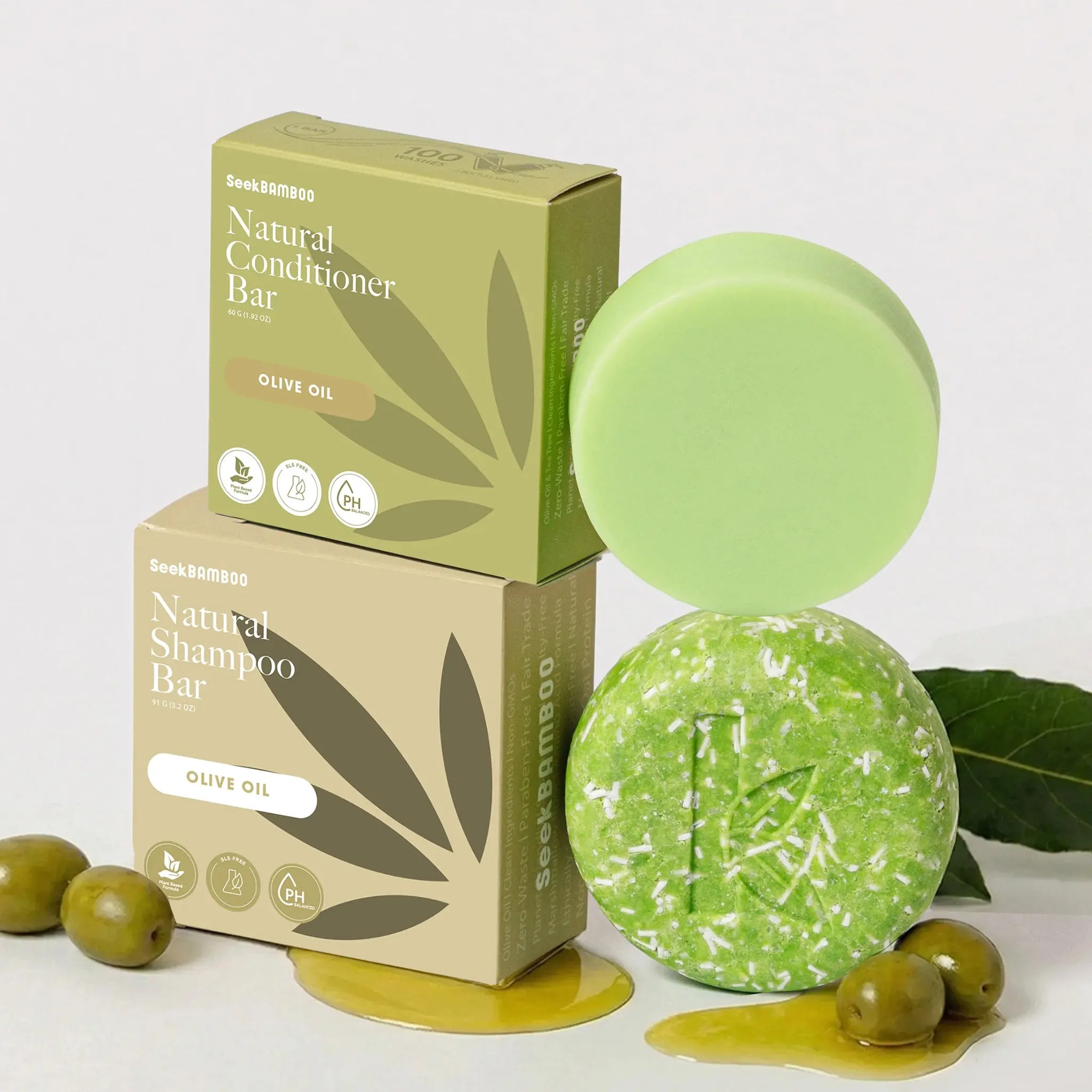 Olive shampoo and conditioner bars with packaging on a white background