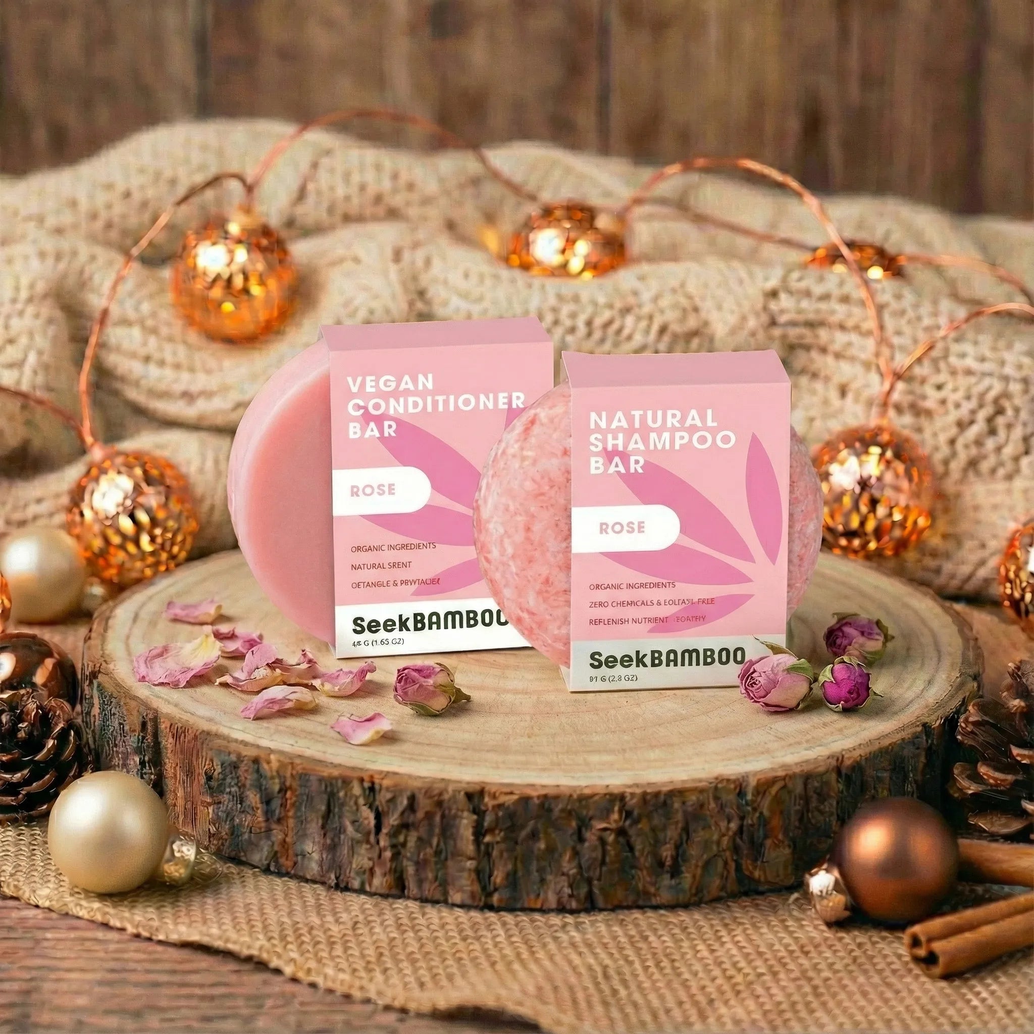 SeekBamboo rose conditioner and natural shampoo bars on a wooden stand with decorative lights and pinecones.