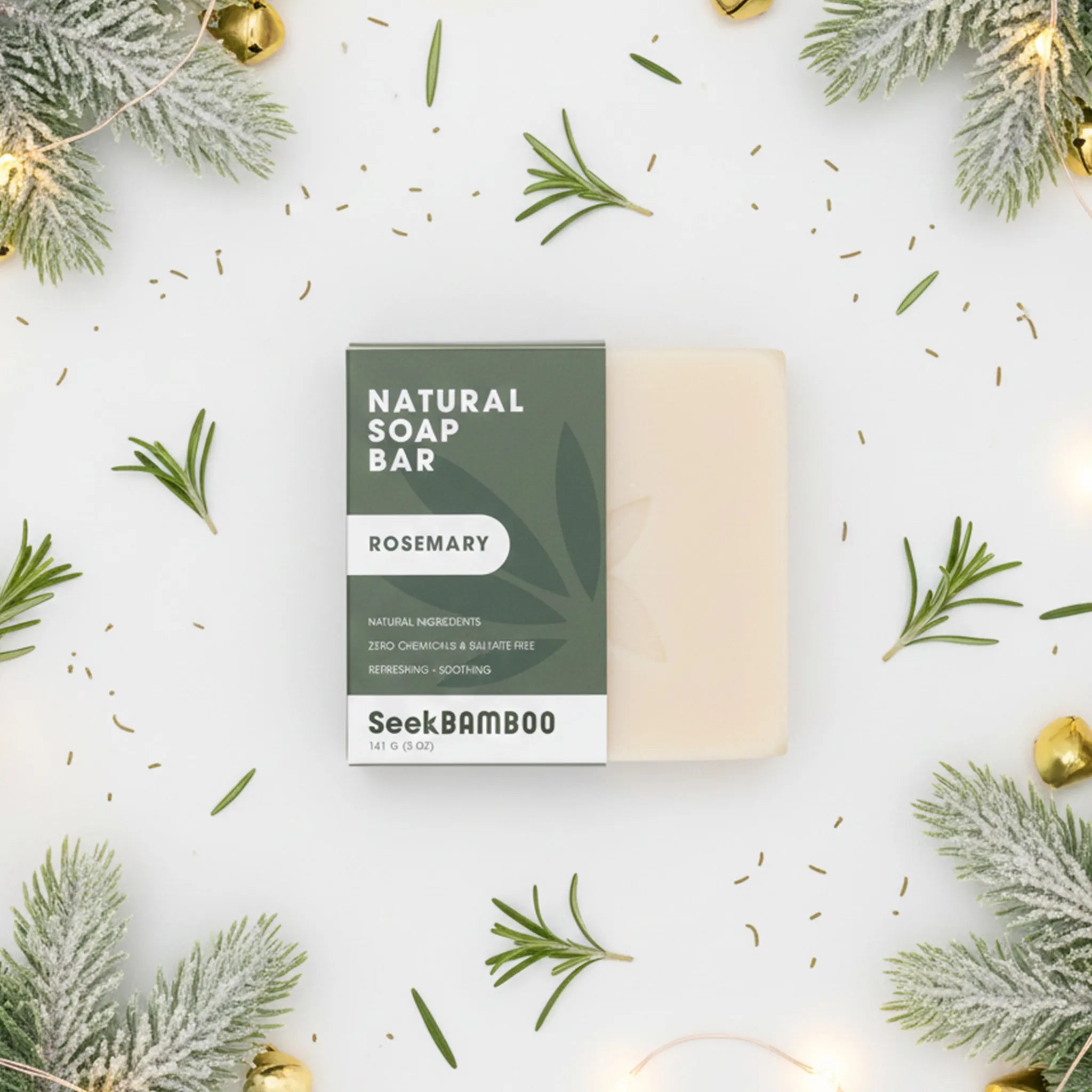 Natural rosemary soap bar with packaging labeled 'SeekBamboo' on a decorative background with rosemary leaves and lights.