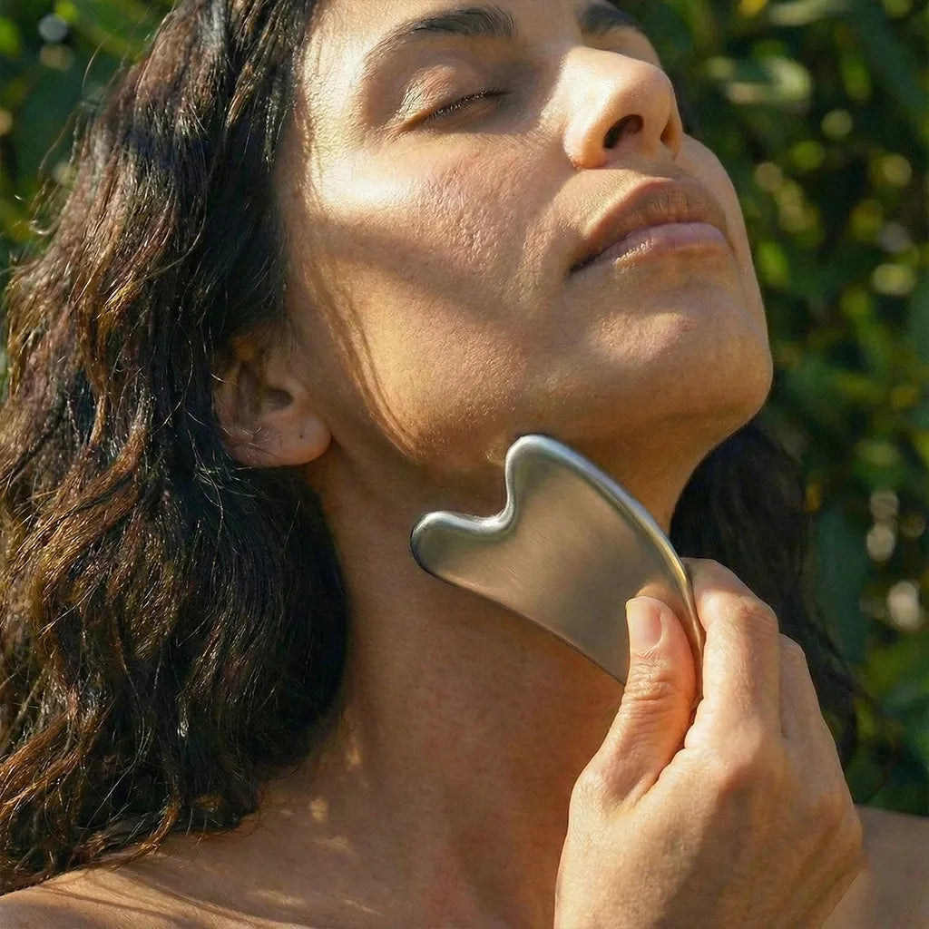 Stainless Steel Gua Sha used on jaw line