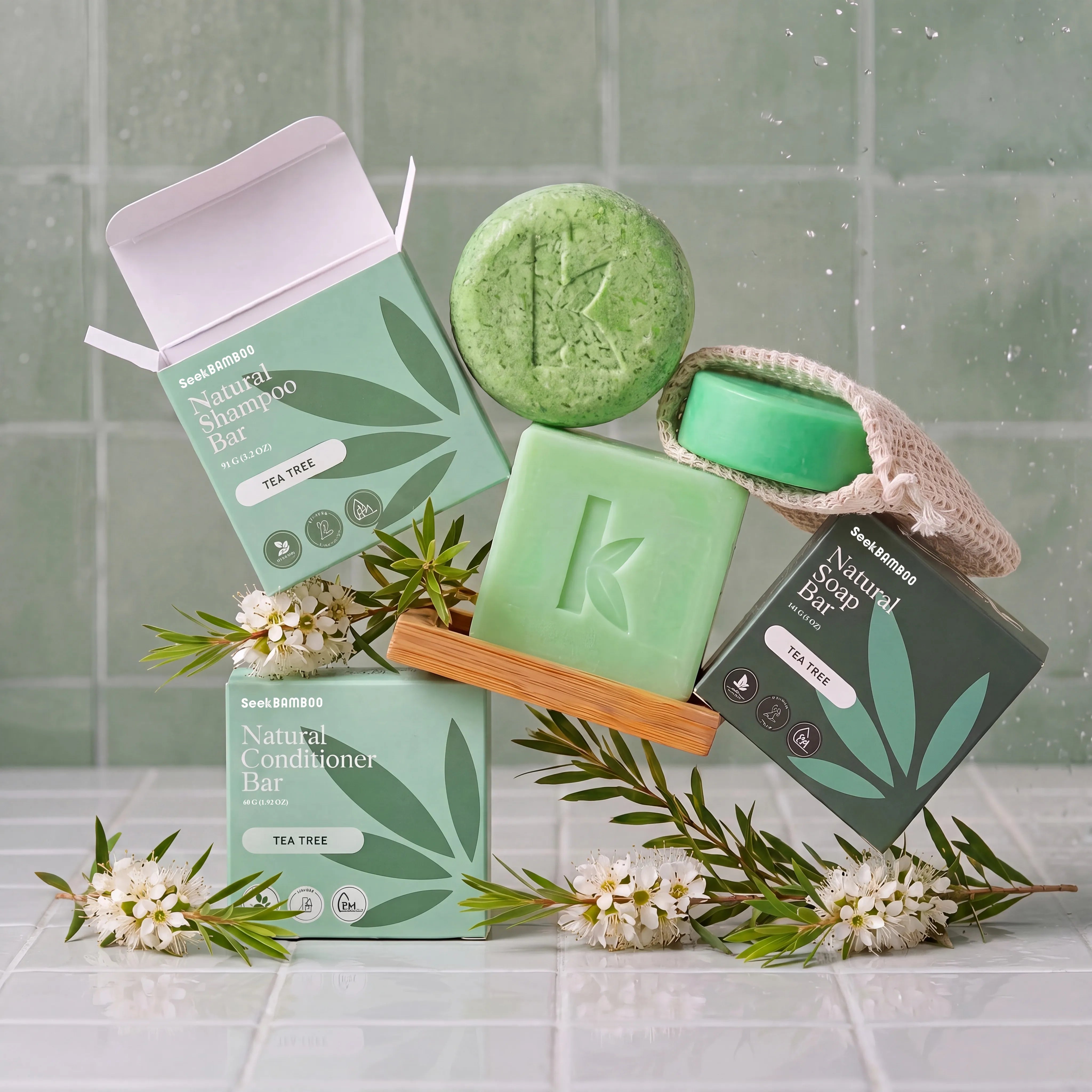 Tea Tree skincare and hair care products with brand logo on a tiled background