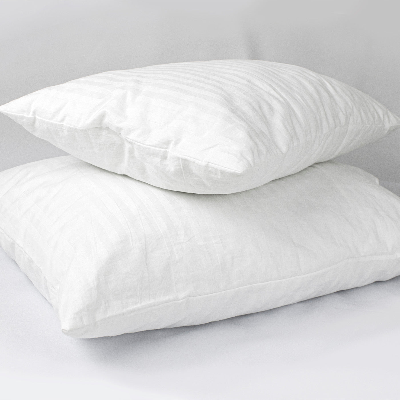 two bamboo pillows on top of each for a blog about are bamboo pillows good