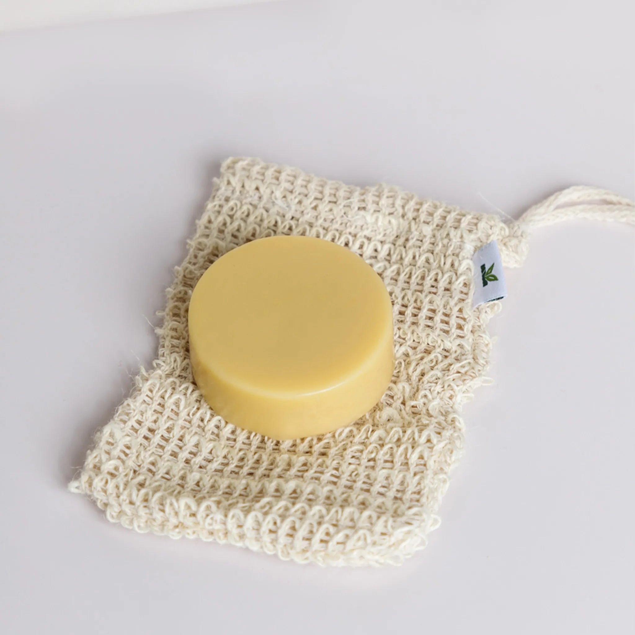 ginger conditioner on a sisal soap saver bag