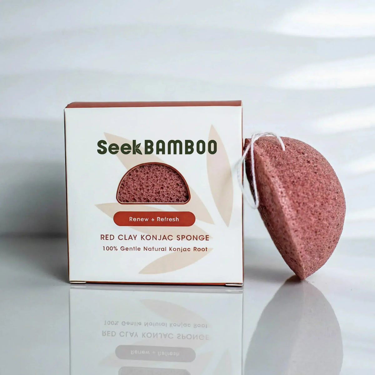 a main product image for a red clay konjac sponge from seek bamboo