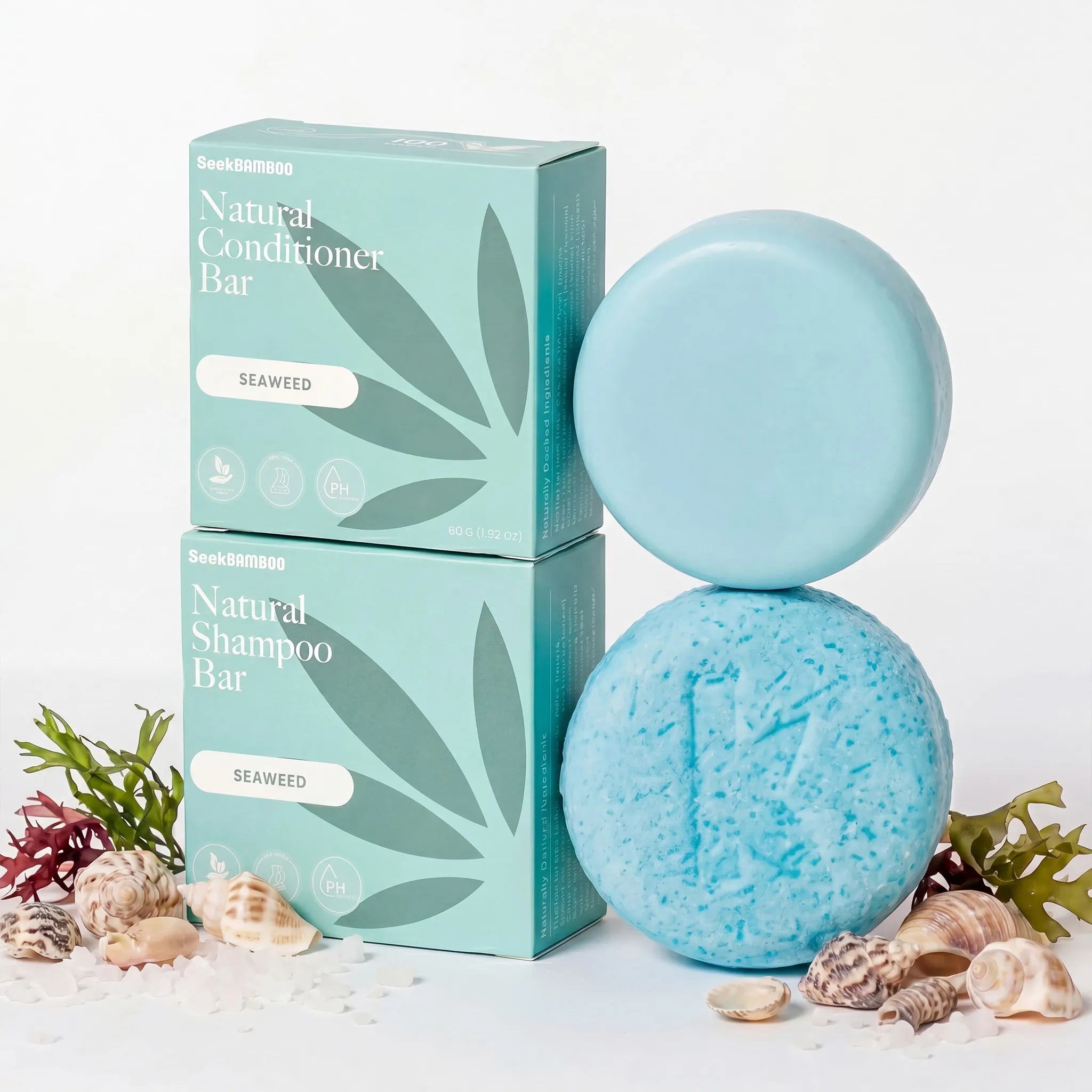seaweed shampoo and conditioner bars for curly hair with its packaging on a white background with seaweed and shells for a main product image