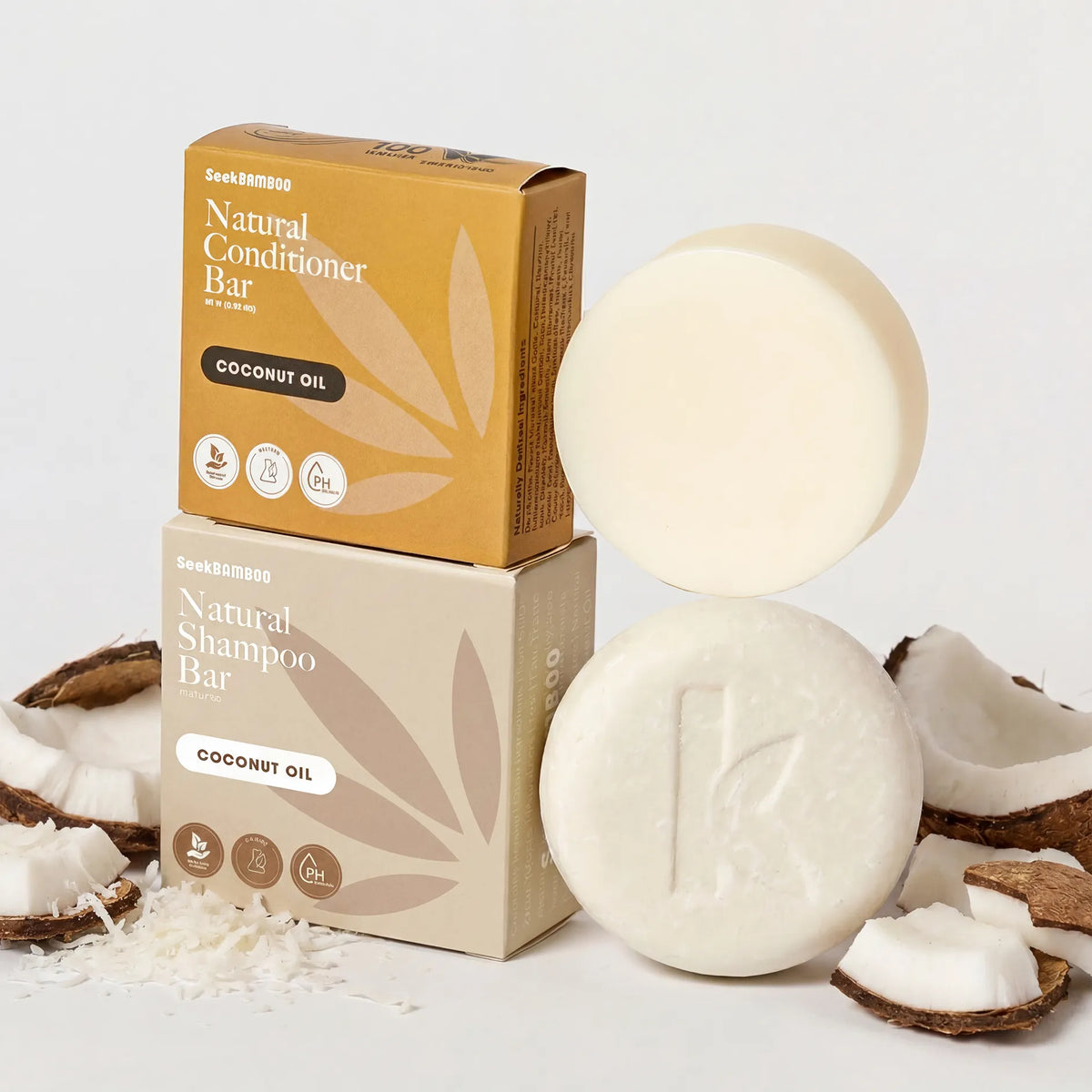 Two boxed hair care coconut shampoo and conditioner bars from SeekBomsoo are displayed with the corresponding round bars and boxes in front.