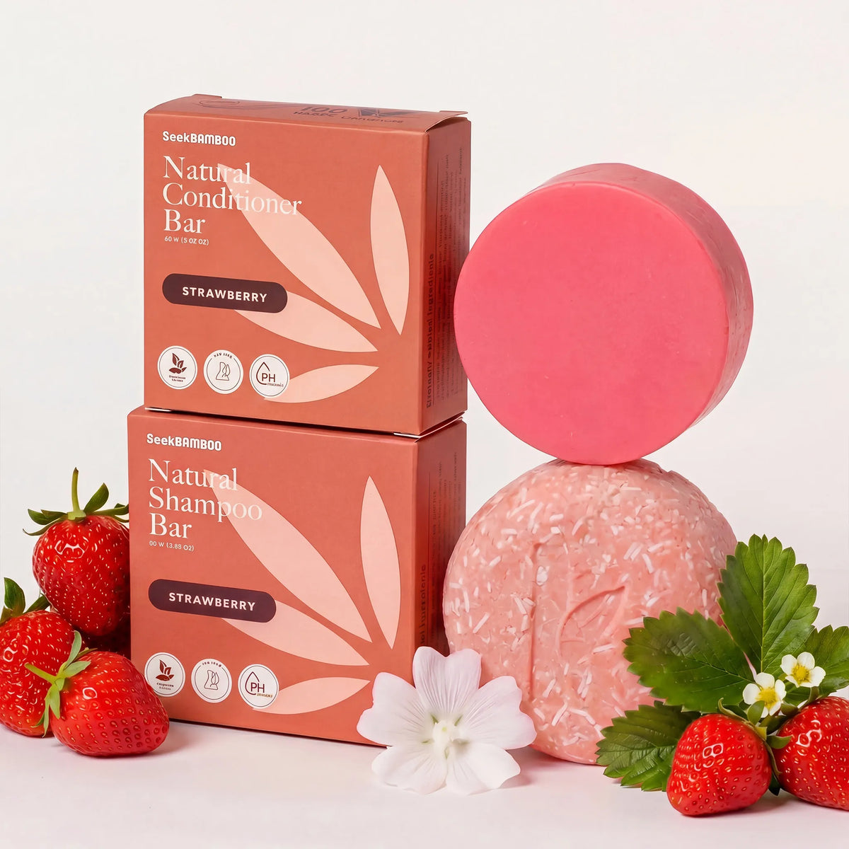 natural bar shampoo and conditioner that is strawberry scented on a falt background