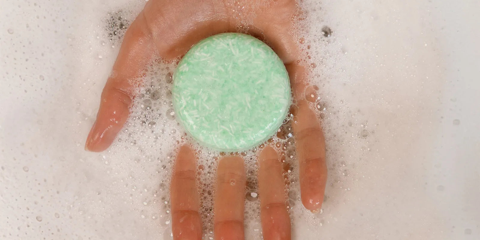 shampoo bar suds up on top a hand. This shampoo bar is paraben-free